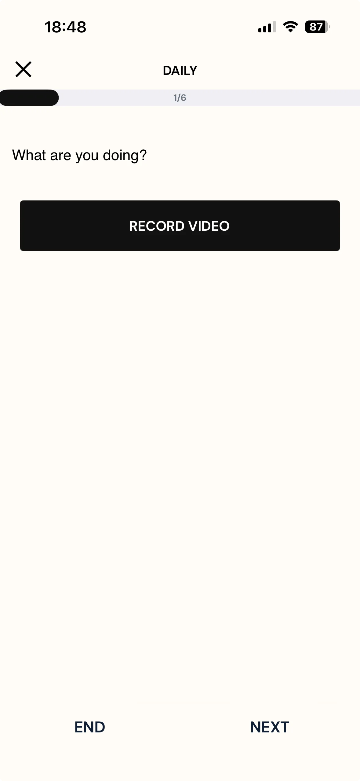 A multimedia question on a phone showing the question text and a single RECORD VIDEO button, with END and NEXT below