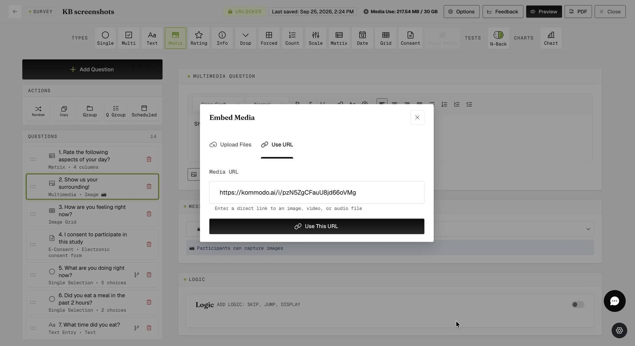 The Embed Media modal on the Use URL tab with a direct image link pasted into the Media URL field and a Use This URL button below it