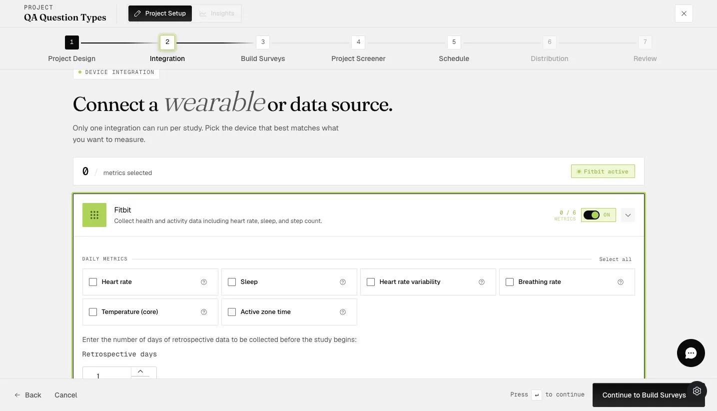 The Fitbit integration toggled on, showing the Daily Metrics and Retrospective days options