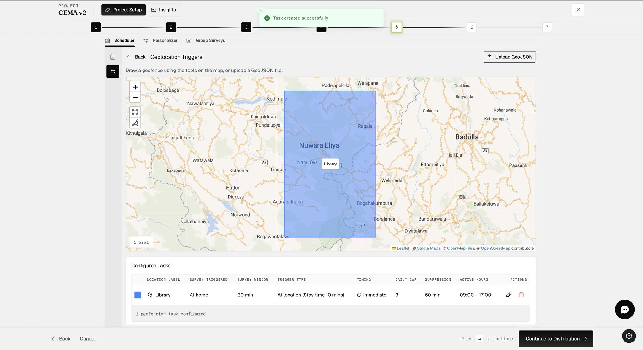The Geolocation Triggers page after a task is created, with a toast confirming it, one labeled geofenced area shaded on the map and a Configured Tasks table beneath listing the location label, survey triggered, survey window, trigger type, timing, daily cap, suppression window and active hours, with edit and delete controls