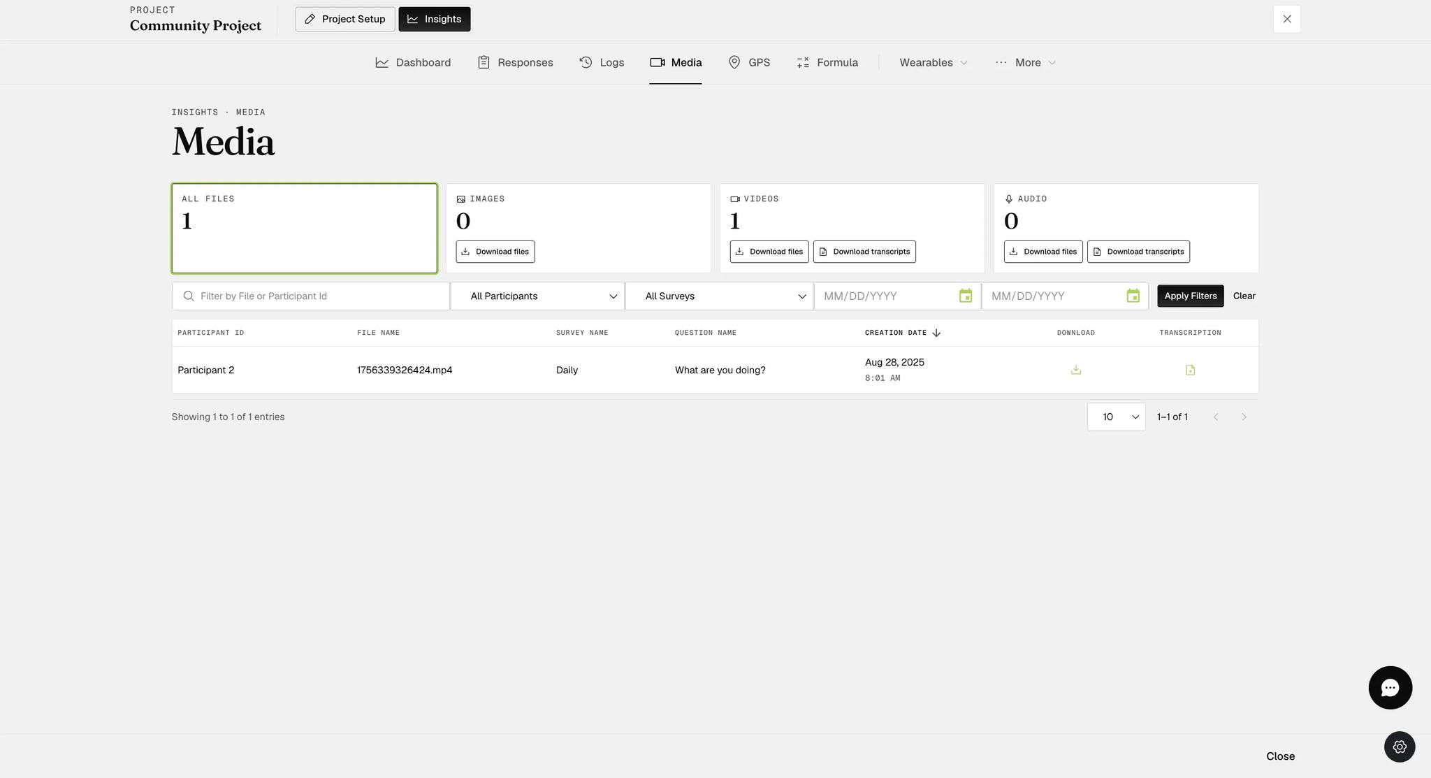 The Insights Media tab with cards counting all files, images, videos and audio, download buttons on the type cards but not the all-files card, a filter row, and a table listing one video with its participant, survey, question and creation date