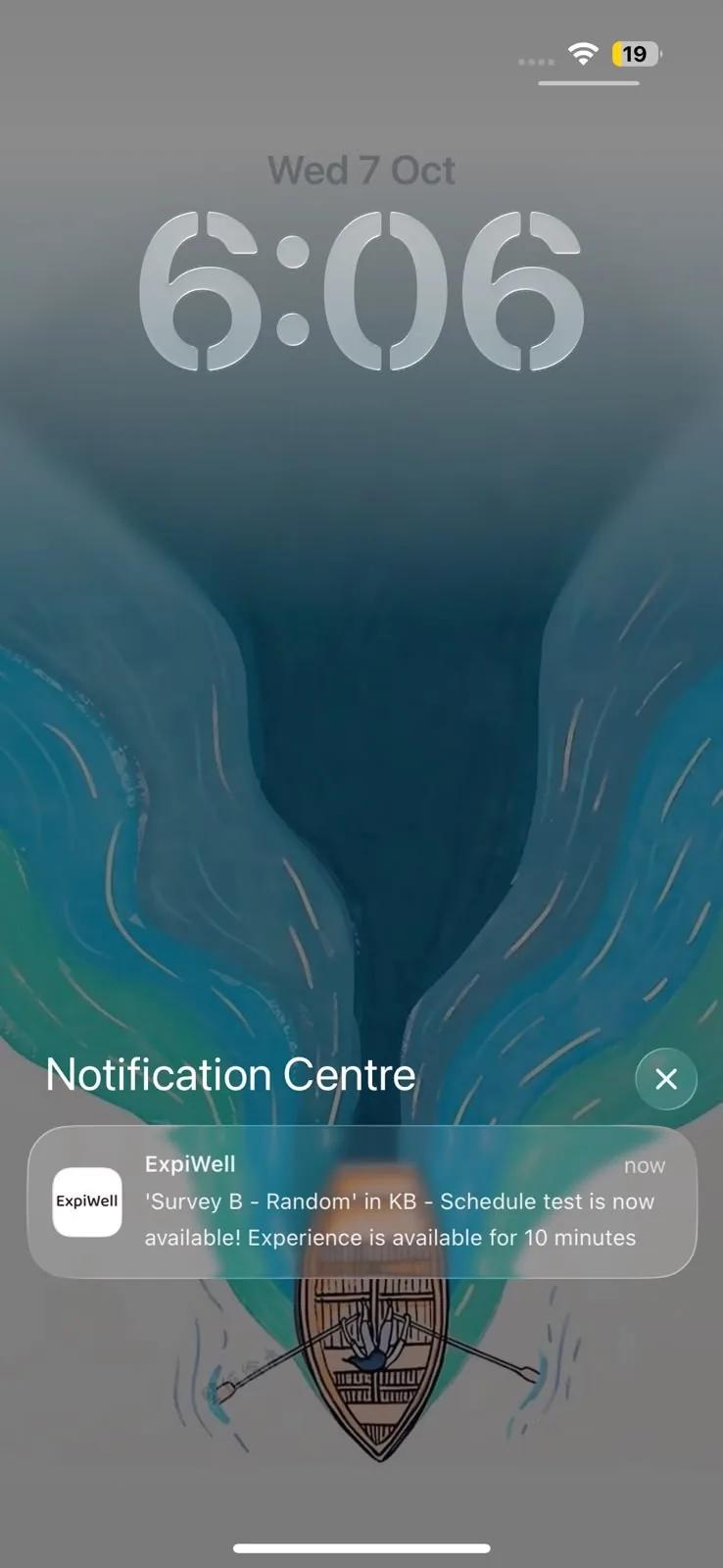 An ExpiWell notification on the iPhone lock screen reading: 'Survey B - Random' in KB - Schedule test is now available! Experience is available for 10 minutes